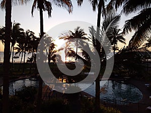 Relaxing by the swimming pool at Tangalooma Island Resort, Moreton Island, QLD, Australia