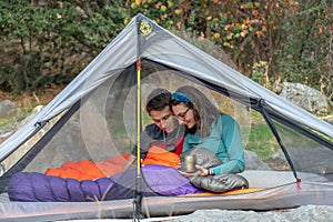 Relaxing in a tent while camping