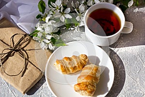 Relaxing time and happiness with cup of tea with among fresh spring flower.