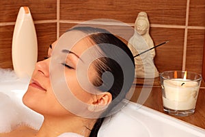 Relaxing woman in bath