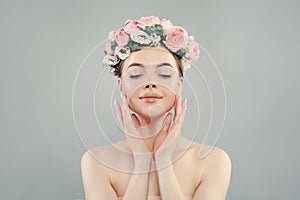 Relaxing woman with clear healthy skin and flowers crown portrait. Natural beauty