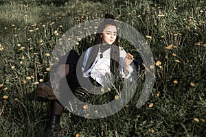 Relaxing woman lying on spring blooming meadow. Girl resting in spring park.