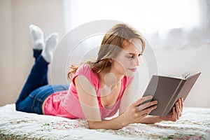Relaxing woman reading book