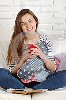 Relaxing woman sit comfortable on sofa