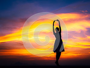 relaxing woman at sunset