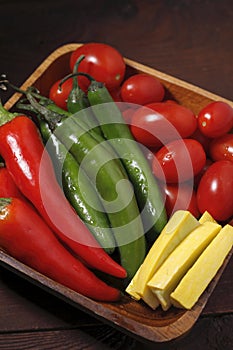 Close up of tomatoes, peppers, and squash.