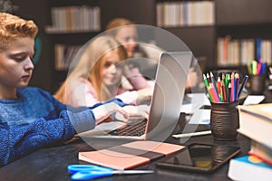 Reliable boy studying with computer