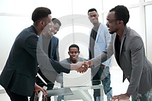 Reliable handshake of business partners over the desktop.