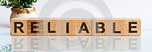 RELIABLE word made with building blocks on a light background