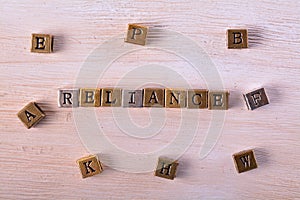 Reliance word metal block photo