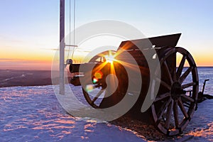 Relic of first world war cannon on top of mount grappa in veneto region in italy with snow at sunrise