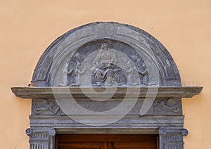 Relief above the entrance to the Oratory Santa Maria Assunto in Portofino, Italy photo