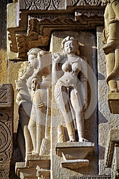 Relief carving of Apsara and Nayika on the wall of Lakshmana Temple