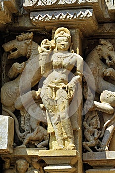 Relief carving of Apsara and Nayika on the wall of Lakshmana Temple