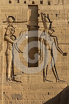 Relief Carvings of Hathor and Osiris on the First Pylon of the Temple of Isis at Philea, Aswan Egypt