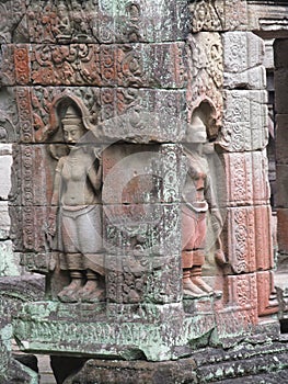 Relief carvings on stone walls of ancient sacred temple in the city of Ankgor Wat