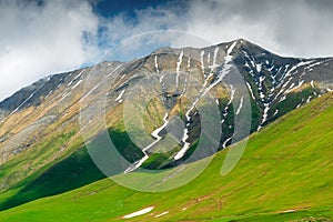 Relief of the Caucasus Mountains with the remains of snow in the hollows, Caucasus Mountains in June