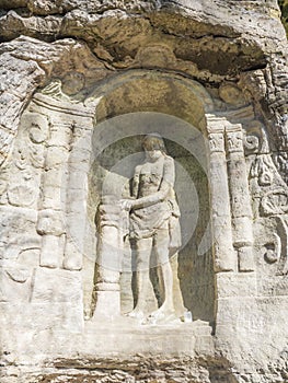 Relief of Christ after flogging sculpted to the sandstone rock in 18th century near village Radvanec in luzicke hory photo