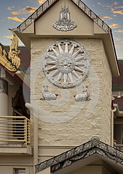 Relief of the dharma wheel above two sitting deer on the outside of the Buddhist Center of Dallas, Texas.