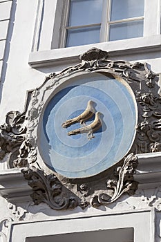 Relief on facade of old building, birds, Nerudova street, Prague, Czech Republic