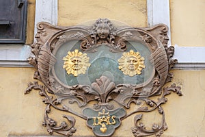 Relief on facade of old building,two suns, Nerudova street, Prague, Czech Republic