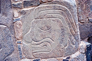 Relief representing severed head blooding at archaeological complex Sechin near Casma photo