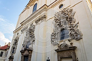 Relief sculpture on facade of the Church of Saint James The Greater with Minorite monastery in Old Town of Prague, Czech Republic