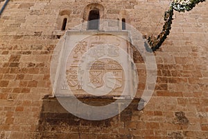 Relief with shields on one of the facades of the Santiago Apostol church in Villena, Alicante, Spain photo