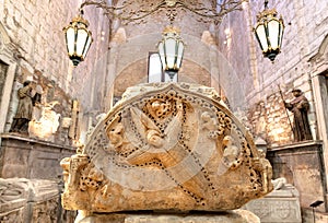 Relief on tomb of Fernando I in 14th century Gothic Carmo Convent, Lisbon. Medieval art with miracles of St. Francisco