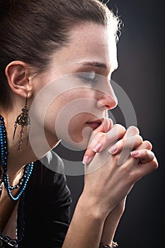 Religion concept - woman and her prayer