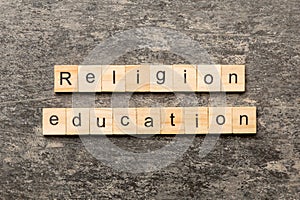 religion education word written on wood block. religion education text on cement table for your desing, concept