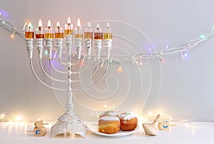 Religion image of jewish holiday Hanukkah background with menorah (traditional candelabra)