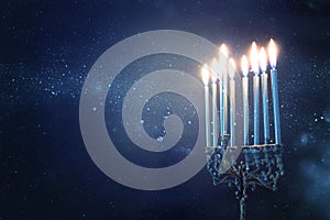 Religion image of jewish holiday Hanukkah background with menorah traditional candelabra and candles
