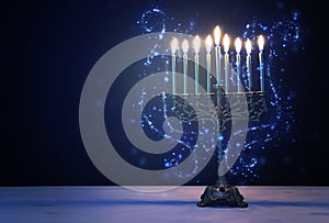 Religion image of jewish holiday Hanukkah background with menorah traditional candelabra and candles