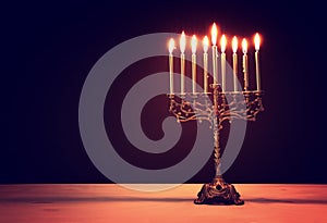 Religion image of jewish holiday Hanukkah background with menorah traditional candelabra and candles