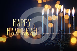Religion image of jewish holiday Hanukkah background with menorah traditional candelabra and candles photo