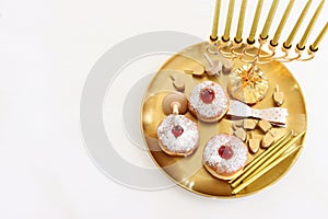 Religion image of jewish holiday Hanukkah background with menorah (traditional candelabra) and candles. top view