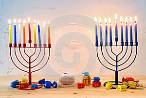 religion image of jewish holiday Hanukkah background with menorah & x28;traditional candelabra& x29;, spinning top and doughnut