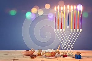 religion image of jewish holiday Hanukkah background with menorah & x28;traditional candelabra& x29;, spinning top and doughnut