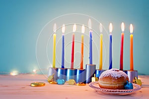 religion image of jewish holiday Hanukkah background with menorah & x28;traditional candelabra& x29;, spinning top and doughnut