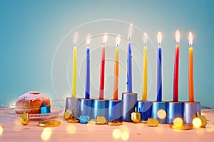 religion image of jewish holiday Hanukkah background with menorah & x28;traditional candelabra& x29;, spinning top and doughnut