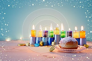 religion image of jewish holiday Hanukkah background with menorah & x28;traditional candelabra& x29;, spinning top and doughnut