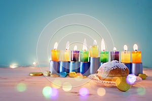 religion image of jewish holiday Hanukkah background with menorah & x28;traditional candelabra& x29;, spinning top and doughnut