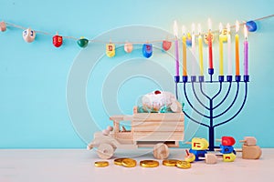 religion image of jewish holiday Hanukkah with menorah & x28;traditional candelabra& x29;, spinning top and doughnut