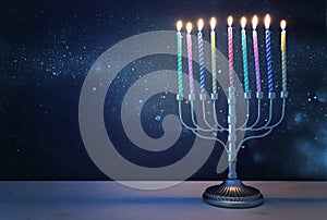 religion image of jewish holiday Hanukkah with white menorah & x28;traditional candelabra& x29;