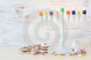 religion image of jewish holiday Hanukkah with white menorah & x28;traditional candelabra& x29;