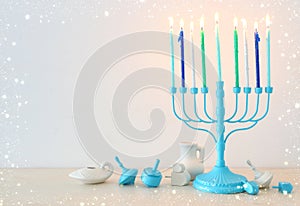 religion image of jewish holiday Hanukkah with white menorah & x28;traditional candelabra& x29;