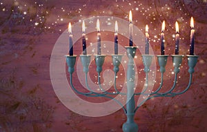 religion image of jewish holiday Hanukkah with white menorah & x28;traditional candelabra& x29;