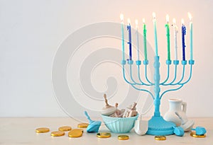 religion image of jewish holiday Hanukkah with white menorah & x28;traditional candelabra& x29;