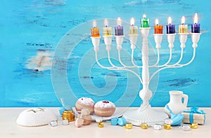 religion image of jewish holiday Hanukkah with white menorah & x28;traditional candelabra& x29;